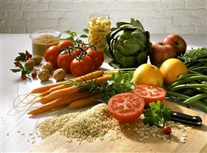 Still life with vegetables, oranges, rice, nuts, raw sugar etc