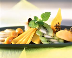 Exotic fruit salad with mint leaves