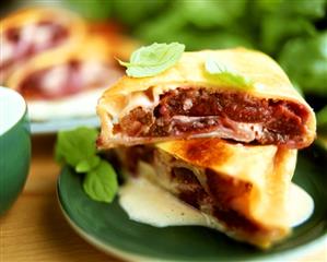 Plum strudel with mint leaves