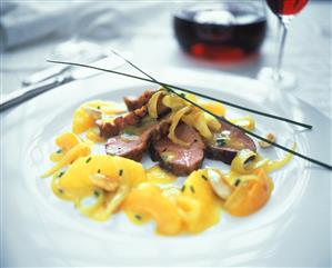 Duck breast with orange sauce, apricots and almonds