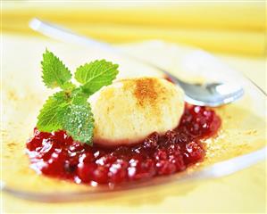 Quark dumplings with cranberry compote and lemon balm