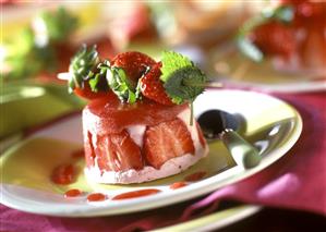 Strawberry mousse, with fresh strawberries on a skewer