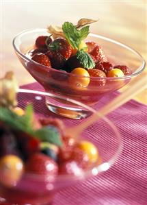 Mixed berries and physalis in sweet tomato syrup