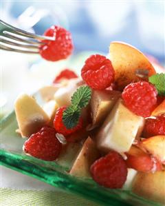 Fruit salad with apples, raspberries and cinnamon