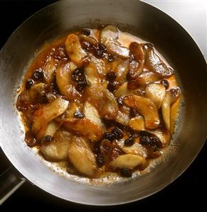 Preparing Calvados apples with raisins