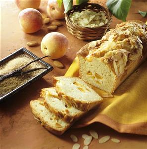 Peach & almond cake surrounded by ingredients