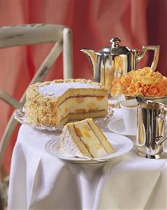 Sponge quark cake with fruit on coffee table (1)