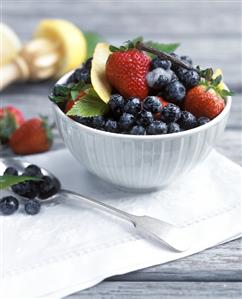 Berry salad with sugar and vanilla pod