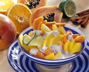 Mango and papaya salad with sour cream and cinnamon