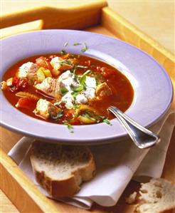 Tomato and fennel soup with diced salmon and basil cream