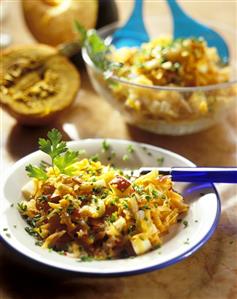 Spicy pumpkin salad with apple, carrots and herbs