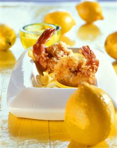 Deep-fried citrus shrimps; fresh lemons beside them (2)