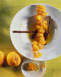 Kumquat chain with cinnamon sticks in orange sauce (1)