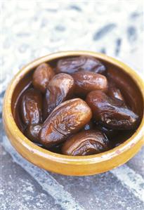 Dates in brown earthenware dish