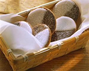 Amerikaner: cookies with icing & chocolate glaze in basket