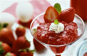 Strawberry mousse with blobs of cream