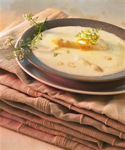 Creamed asparagus soup with orange zest and herbs