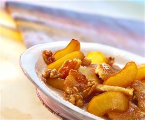 Apple pancake with walnuts and icing sugar