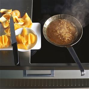 Caramelising orange segments