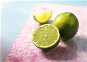 Whole lime, lime half and wedge