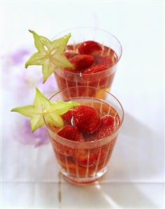 Strawberry punch in glasses with slices of carambola