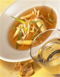 Consomme with asparagus, strips of vegetable & fresh tarragon