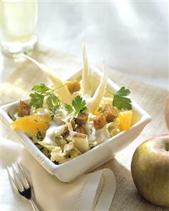 Celery and Chinese cabbage salad with fruit and croutons