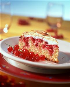 Piece of redcurrant and almond meringue cake