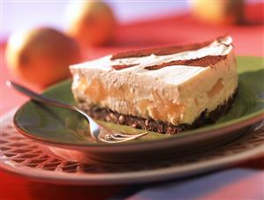 Piece of pear cheesecake with cocoa stripes