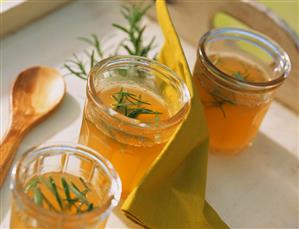 Apple and rosemary jelly in jam jars