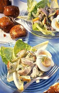 Herring salad with potatoes, apples & egg; bread roll