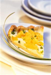 Piece of pineapple tart with coconut cream & pistachios