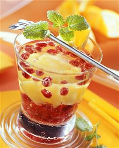 Pomegranate punch with pineapple in glass