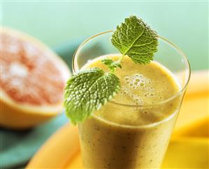 Grapefruit and lemon balm drink with fresh lemon balm