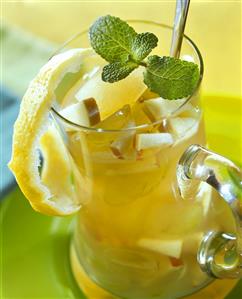 Green tea sangria with apples and lemon peel