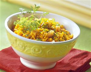 Wok-cooked red lentils with papaya & coriander leaves