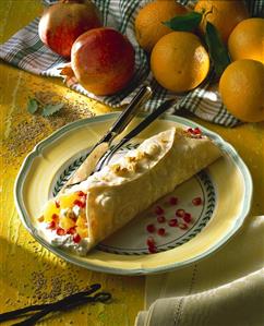 Pomegranate and orange wrap with sesame praline