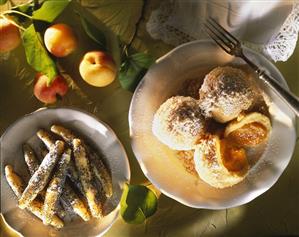 Apricot dumplings & poppy seed noodles with icing sugar