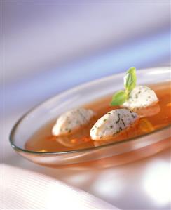 Tomato broth with basil dumplings