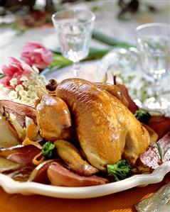 Guinea-fowl with pears on large plate