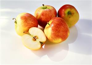 Apples with drops of water and half an apple