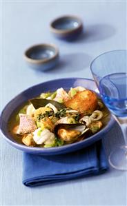 Mediterranean fish soup with thyme and baguette