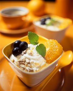 Mandarin yoghurt muesli with grapes and sunflower seeds