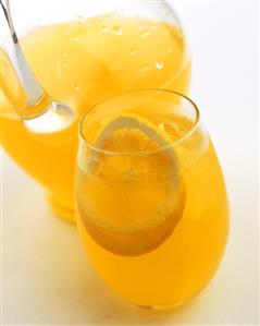 Citrus fruit drink with ice cubes