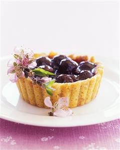 Cherry tartlets with flower decoration