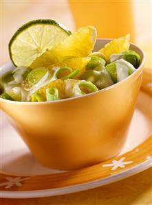 Leek and orange salad with slice of lime