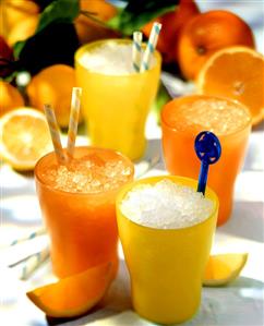 Lemon and orange granitas in yellow and orange beakers