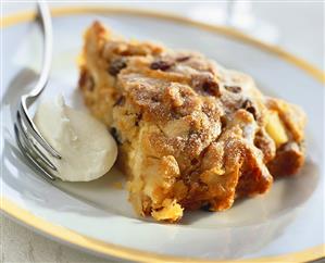 Piece of apple cinnamon cake with icing sugar