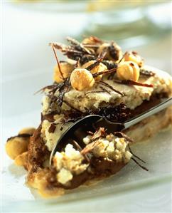 Piece of chocolate meringue cake with spoon