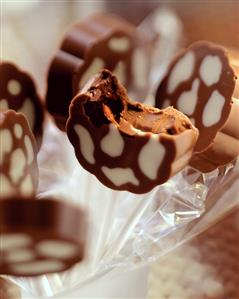 Two-colour (cow markings) chocolates), one bitten